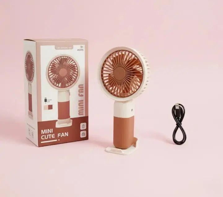 Mini Cute Fan – Portable USB Rechargeable Handheld Cooling Fan for Kids & Adults, Stand/Base Included (Random Color) BuyMarto