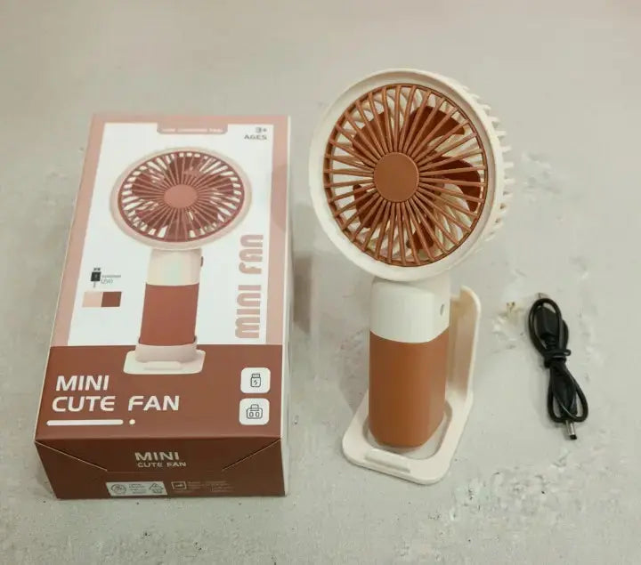 Mini Cute Fan – Portable USB Rechargeable Handheld Cooling Fan for Kids & Adults, Stand/Base Included (Random Color) BuyMarto